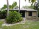 Rear view of house with covered patio at 4973 Village Gardens Dr # 50, Sarasota, FL 34234