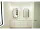 Double vanity bathroom with white cabinets and quartz countertops at 1094 Rotonda Cir, Rotonda West, FL 33947