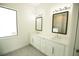 Double vanity bathroom with white cabinets and quartz countertops at 1094 Rotonda Cir, Rotonda West, FL 33947