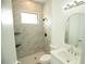 Bathroom with marble shower and modern vanity at 1094 Rotonda Cir, Rotonda West, FL 33947