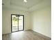 Spacious bedroom with sliding glass doors leading to patio at 1094 Rotonda Cir, Rotonda West, FL 33947