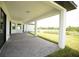 Covered patio overlooks a serene backyard with water view at 1094 Rotonda Cir, Rotonda West, FL 33947