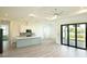 Open concept kitchen with island, stainless steel appliances, and gray cabinets at 1094 Rotonda Cir, Rotonda West, FL 33947