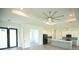 Open living room with high ceilings, ceiling fan, and access to kitchen at 1094 Rotonda Cir, Rotonda West, FL 33947