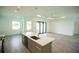 Open concept kitchen with island and stainless steel appliances at 1094 Rotonda Cir, Rotonda West, FL 33947