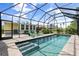 Relaxing screened-in pool with patio and backyard view at 521 Live Oak St, Venice, FL 34285