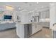 Modern kitchen with island, stainless steel appliances, and breakfast bar at 4507 Terrazza Ct, Bradenton, FL 34211
