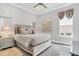 Spacious bedroom with a king-size bed and gray color scheme at 4507 Terrazza Ct, Bradenton, FL 34211