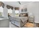 Serene bedroom with a comfortable bed and large windows at 4507 Terrazza Ct, Bradenton, FL 34211