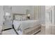 Bright bedroom with plush bedding and a mirrored nightstand at 4507 Terrazza Ct, Bradenton, FL 34211