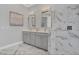 Modern bathroom with gray cabinets and marble flooring at 4507 Terrazza Ct, Bradenton, FL 34211