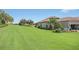 Landscaped yard with lush grass at 4507 Terrazza Ct, Bradenton, FL 34211