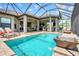 Resort-style pool with outdoor kitchen and access from the house at 4507 Terrazza Ct, Bradenton, FL 34211