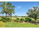 Landscaped yard with golf course view at 4507 Terrazza Ct, Bradenton, FL 34211