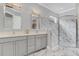 Elegant bathroom with double vanity and marble shower at 4507 Terrazza Ct, Bradenton, FL 34211