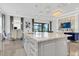 Modern kitchen with large island, stainless steel appliances, and breakfast bar at 4507 Terrazza Ct, Bradenton, FL 34211