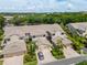 Aerial view of townhouses with lush landscaping at 1736 Starling Dr # 202, Sarasota, FL 34231