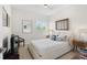 Bright bedroom with a comfortable bed and large windows at 1736 Starling Dr # 202, Sarasota, FL 34231