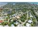 Aerial view of a waterfront community with lush greenery and easy access to the bay at 136 Crescent Dr, Anna Maria, FL 34216