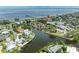Beautiful aerial view of waterfront homes with backyard pools on canals leading to the Gulf of Mexico at 136 Crescent Dr, Anna Maria, FL 34216