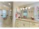 Well-lit bathroom featuring a tiled shower, granite countertops, and modern vanity at 136 Crescent Dr, Anna Maria, FL 34216
