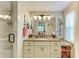 Bathroom featuring granite countertops, a shower, and updated fixtures at 136 Crescent Dr, Anna Maria, FL 34216