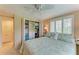 Bedroom with a ceiling fan, spacious closet, ample storage, and plenty of natural light at 136 Crescent Dr, Anna Maria, FL 34216