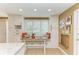 Cozy breakfast nook with built-in seating, window shutters, and ample natural light at 136 Crescent Dr, Anna Maria, FL 34216