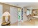 Inviting entryway featuring a decorative door with side-light window and built-in shelving at 136 Crescent Dr, Anna Maria, FL 34216