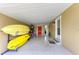 Spacious garage featuring ample storage space for kayaks and bicycles at 136 Crescent Dr, Anna Maria, FL 34216