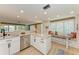 Bright kitchen with a breakfast nook and access to the living area at 136 Crescent Dr, Anna Maria, FL 34216