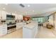 Modern kitchen with stainless steel appliances and an open view to the living area at 136 Crescent Dr, Anna Maria, FL 34216