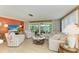 Bright living room with lots of natural light and comfortable seating at 136 Crescent Dr, Anna Maria, FL 34216