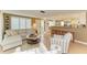 Well-lit living room open to the kitchen, with comfortable seating and bright interior at 136 Crescent Dr, Anna Maria, FL 34216