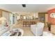Inviting living room open to the kitchen, featuring an adjacent breakfast nook at 136 Crescent Dr, Anna Maria, FL 34216