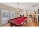 Pool table in a game room with access to a patio at 1833 Sandalwood Dr, Sarasota, FL 34231