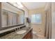 Clean bathroom with granite countertop and shower at 1833 Sandalwood Dr, Sarasota, FL 34231