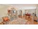 Game room features a pool table, hardwood floors, and a view into the kitchen at 1833 Sandalwood Dr, Sarasota, FL 34231