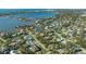 Aerial view showcasing a neighborhood's waterfront location and homes at 1833 Sandalwood Dr, Sarasota, FL 34231