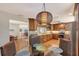 Kitchen features wood cabinets, granite counters, and breakfast nook at 1833 Sandalwood Dr, Sarasota, FL 34231