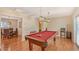 Game room with pool table and hardwood floors at 1833 Sandalwood Dr, Sarasota, FL 34231