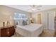 Bright bedroom with a queen-size bed and ensuite bathroom at 1833 Sandalwood Dr, Sarasota, FL 34231