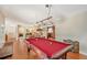 Game room boasts a pool table and hardwood floors at 1833 Sandalwood Dr, Sarasota, FL 34231