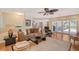 Living room with hardwood floors, comfortable seating, and access to a patio at 1833 Sandalwood Dr, Sarasota, FL 34231