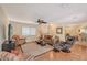 Spacious living room with hardwood floors, comfortable seating, and a ceiling fan at 1833 Sandalwood Dr, Sarasota, FL 34231
