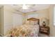 Bedroom with floral bedding and ceiling fan at 1833 Sandalwood Dr, Sarasota, FL 34231