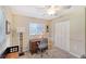 Home office with desk and built-in shelving at 1833 Sandalwood Dr, Sarasota, FL 34231
