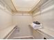 Large walk-in closet with double hanging rods and shelves at 1833 Sandalwood Dr, Sarasota, FL 34231