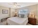 Bedroom with a queen bed and ceiling fan at 1833 Sandalwood Dr, Sarasota, FL 34231