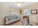Home office with futon and ceiling fan at 1833 Sandalwood Dr, Sarasota, FL 34231